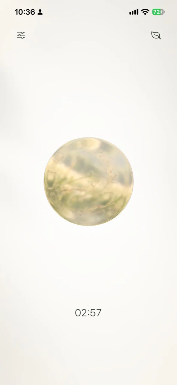 Arrive’s green nature sphere during a meditation, with a 02:57 timer and no selection menu