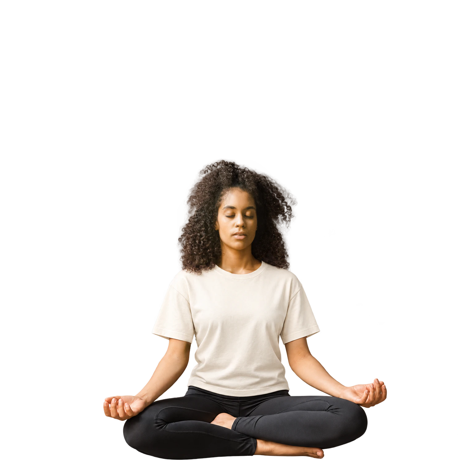 A woman sitting peacefully in meditation, with both hands resting on her knees.